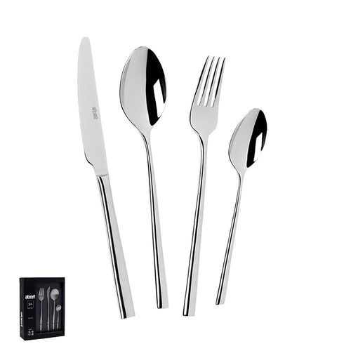 Set di posate in acciaio inox lucido, composto da coltello, forchetta, cucchiaio grande e cucchiaino, accanto alla confezione.