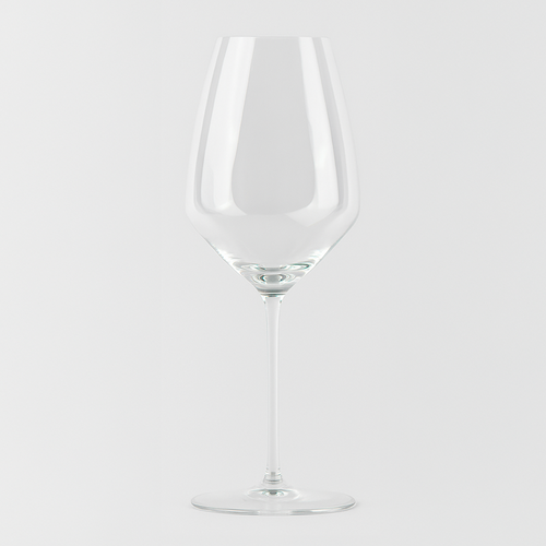 Calice di vino trasparente in vetro con gambo lungo e base tonda, su sfondo grigio chiaro uniforme.