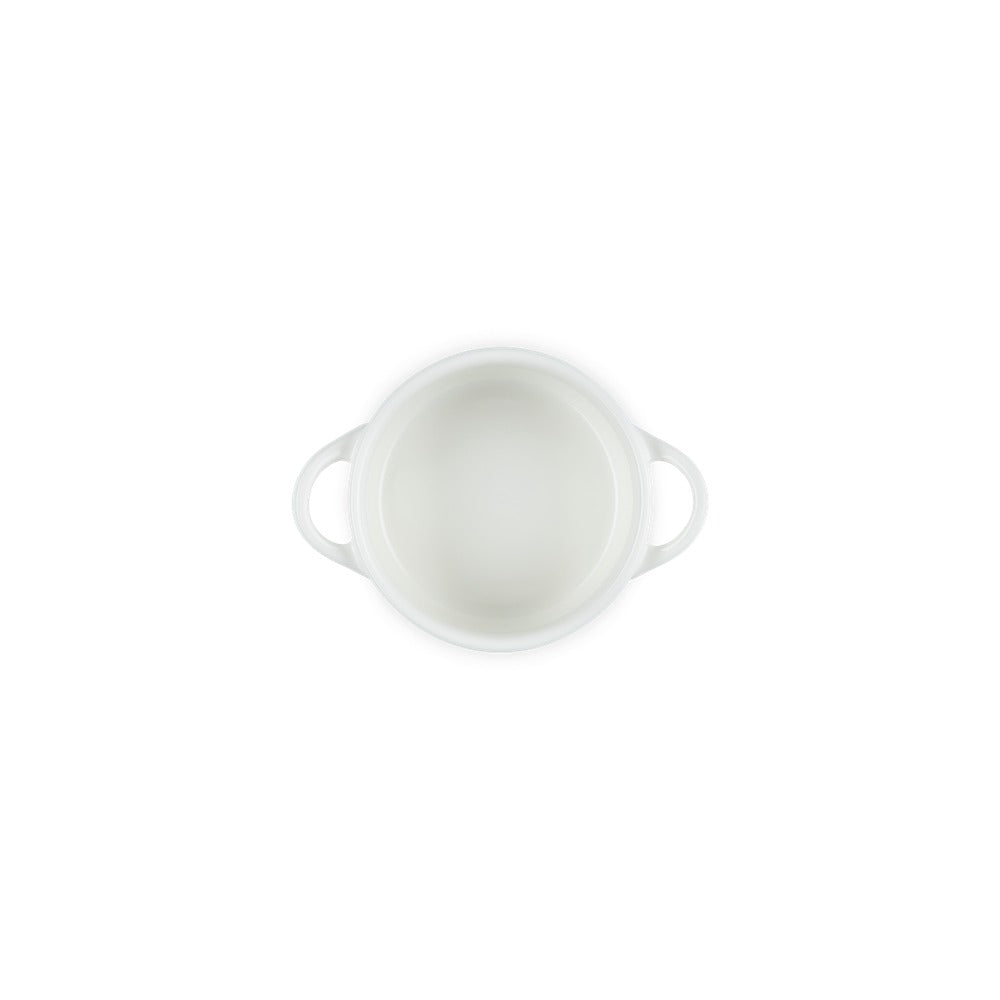 Contenitore bianco ovale con manici, in ceramica lucida, vista dall'alto su sfondo neutro.