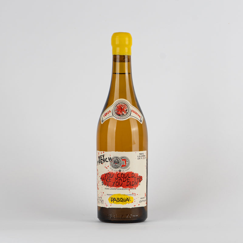 White wine bottle with yellow cap, white label with red and black lettering, white background