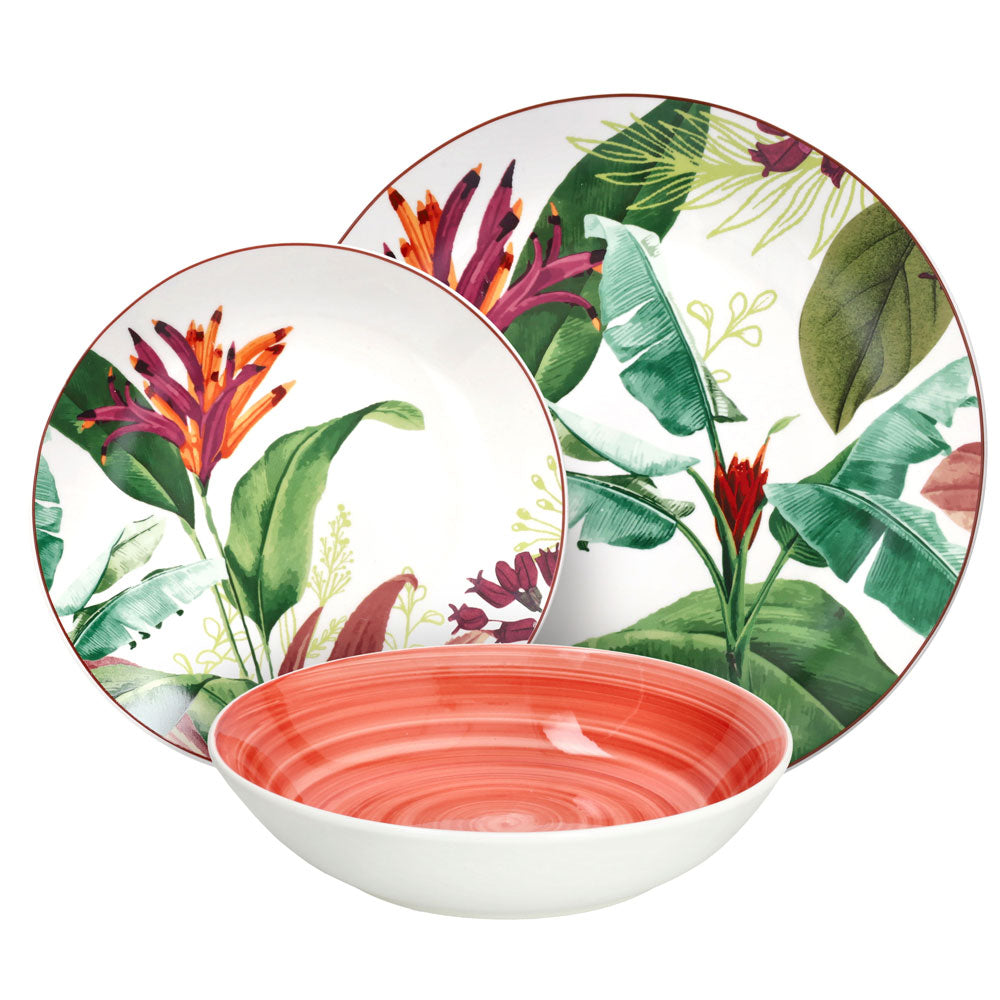 Set di piatti in ceramica con decoro floreale tropicale e piatto fondo interno arancione sfumato su sfondo bianco isolato