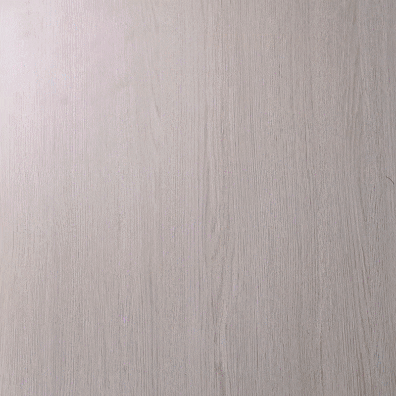 Light wood surface, visible grain, light beige color, no distinctive objects visible.