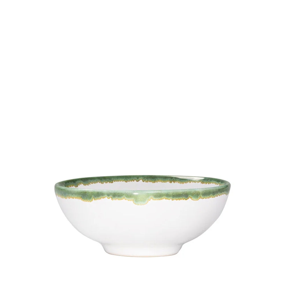 Ciotola in ceramica bianca con bordo verde e dorato, con forma rotonda e fondo leggermente rialzato.