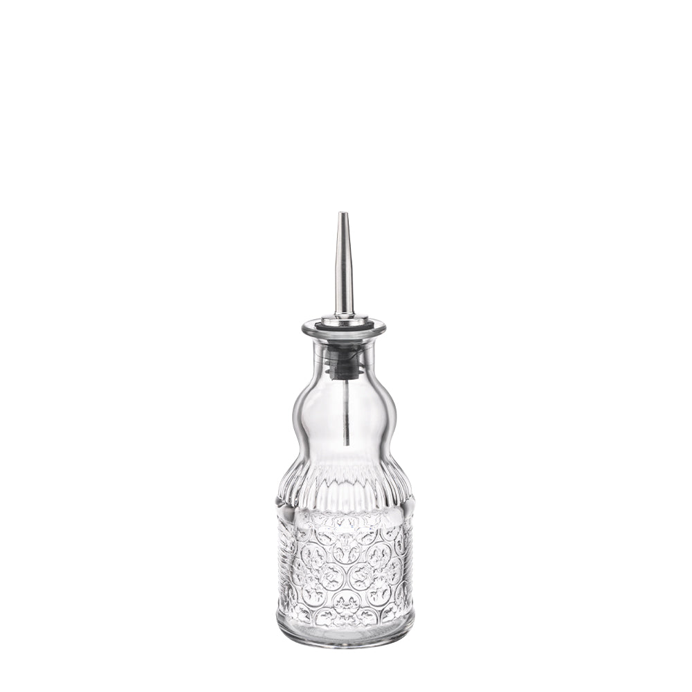 Transparante glazen dispenser met metalen dop, gevormd en versierd met kleine decoratieve bellen.