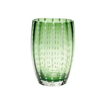 Transparent green glass tumbler with white oval decorations aligned vertically, white background.