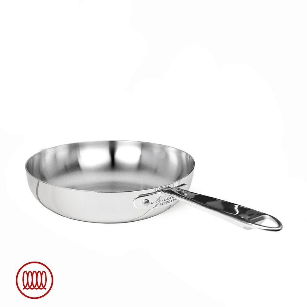 Polished stainless steel frying pan with long handle, low sides and round shape, on white background with red spiral symbol bottom left.