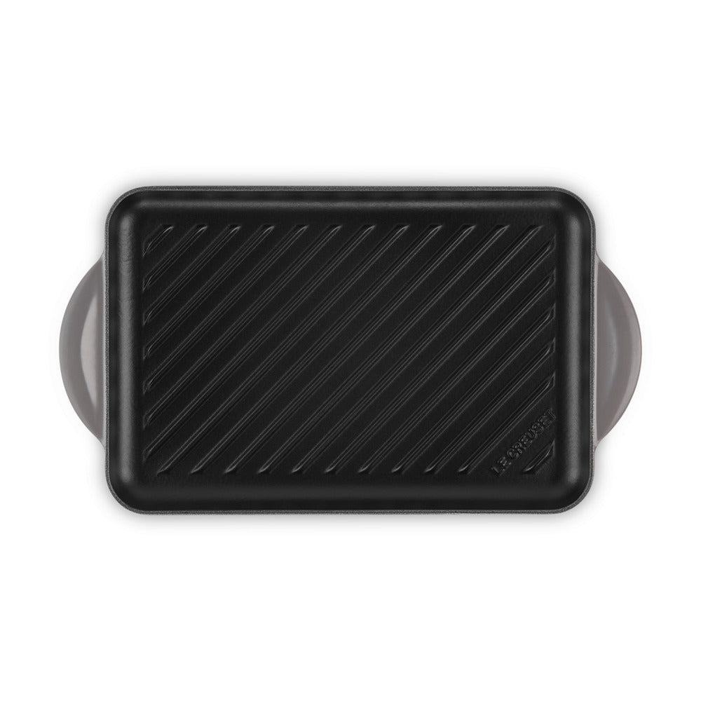 Piastra da cucina rettangolare in alluminio anodizzato nero con manici laterali, superficie rigata.