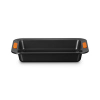 Black rectangular baking tray with orange handles, made of non-stick material, on white background.