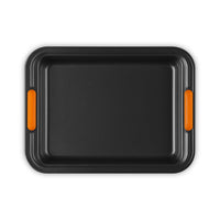 Rectangular black plastic tray with orange handles, smooth surface and raised edges.