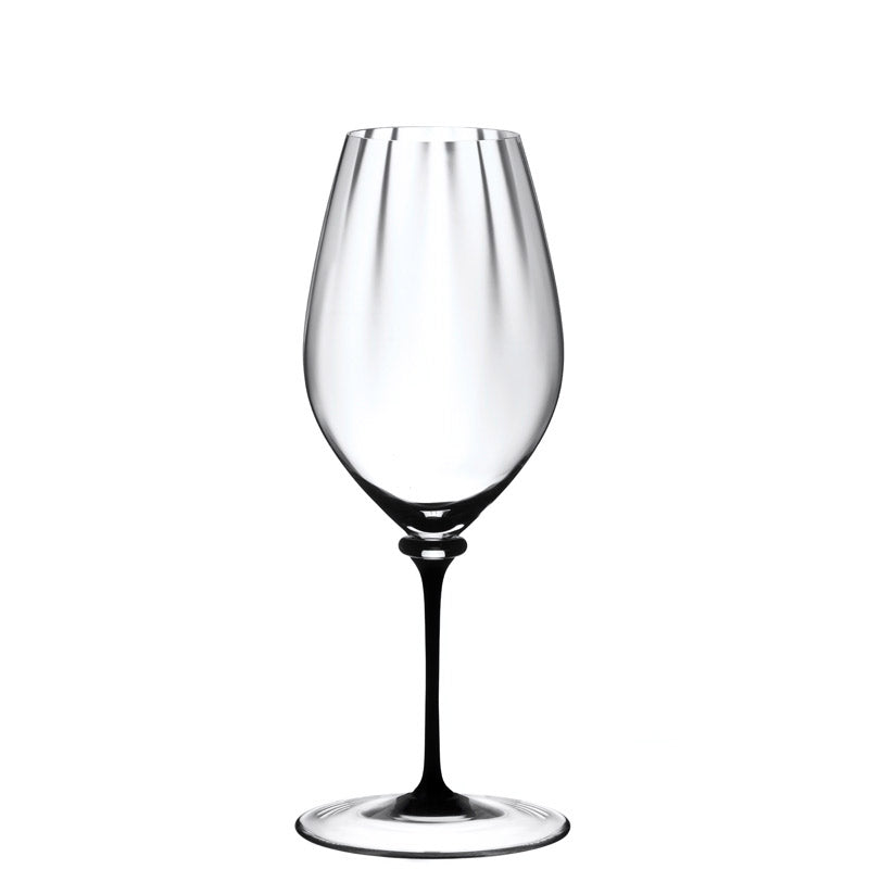 transparent wine glass in glass with elongated bowl and white round base on white background