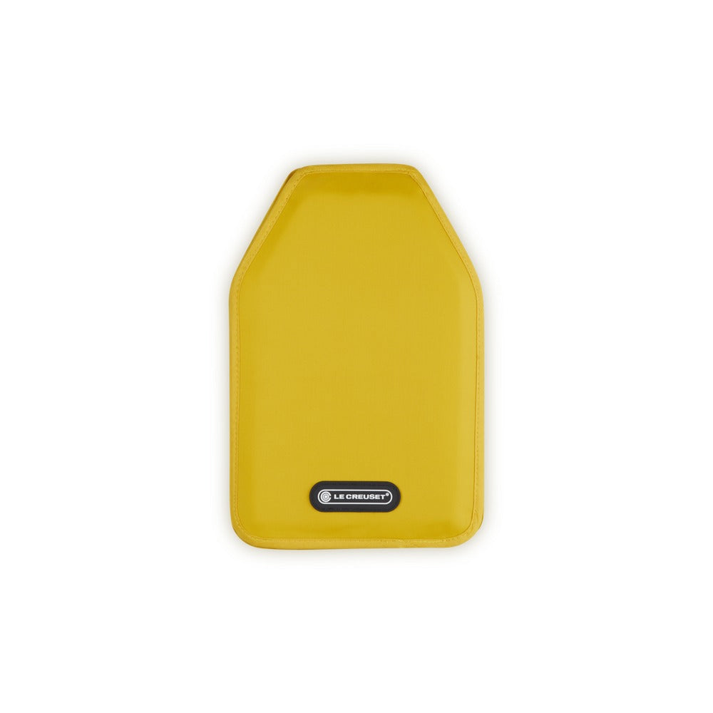 Yellow kitchen accessory, rectangular shape with rounded edges. Features the "LE CREUSET" logo at the bottom.