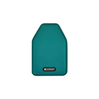 Rectangular kitchen accessory with rounded corners, teal color, apparently textile material, Le Creuset logo visible.