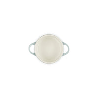 Round casserole white with handles azzurri, viewed from above on white background.