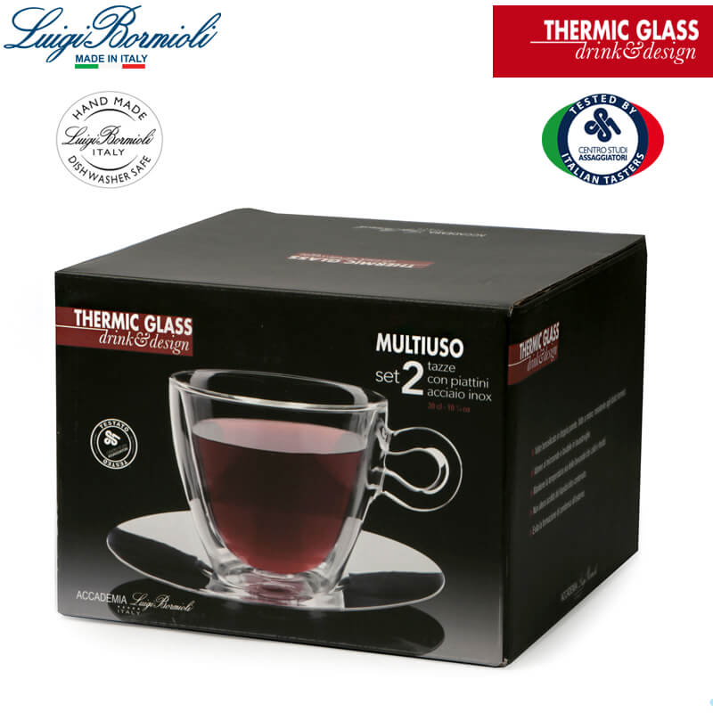 Embalaje negro que contiene set de dos tazas de vidrio térmico transparente con platillos de acero inoxidable