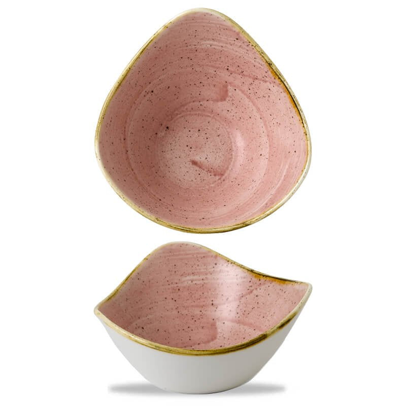 Keramische kommen, een roze met gouden rand gestapeld op een witte, beide asymmetrisch van vorm.