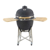 Black egg-shaped barbecue with textured surface, mounted on a metal stand with wooden shelves.