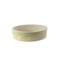 Cylindrical bowl in light yellow with white veining, made of ceramic material. Flat base and smooth edges.
