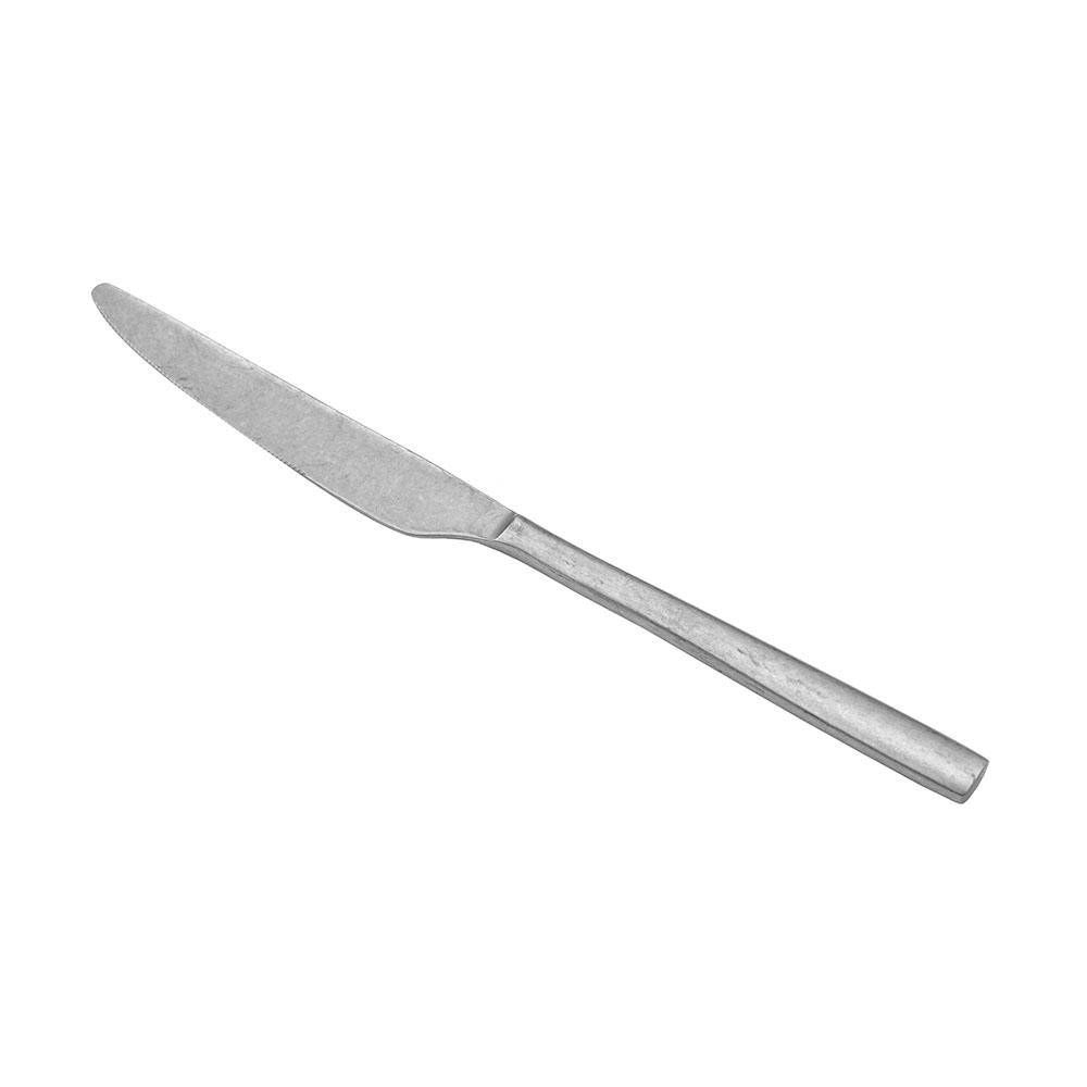 Silver metal knife with thin blade and straight handle, on white background.