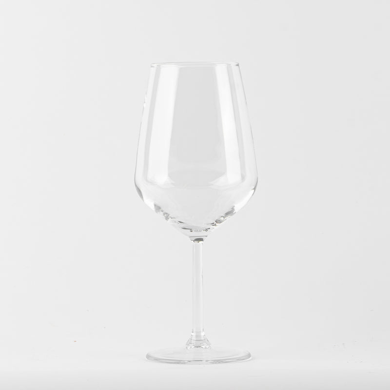 Transparent wine glass with slim stem on uniform white background