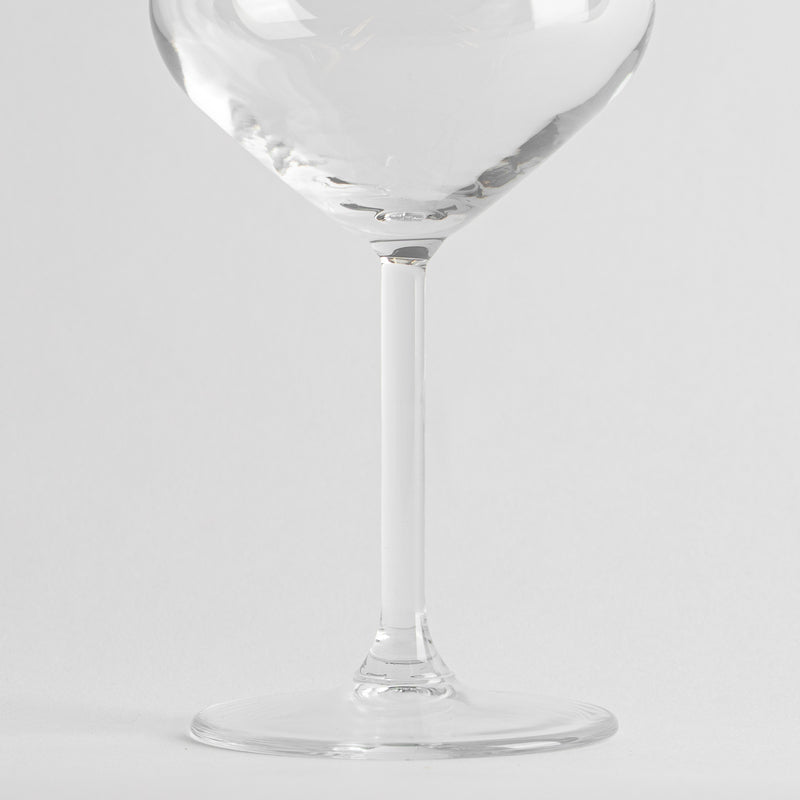 Clear glass with cylindrical stem and flat base on white background