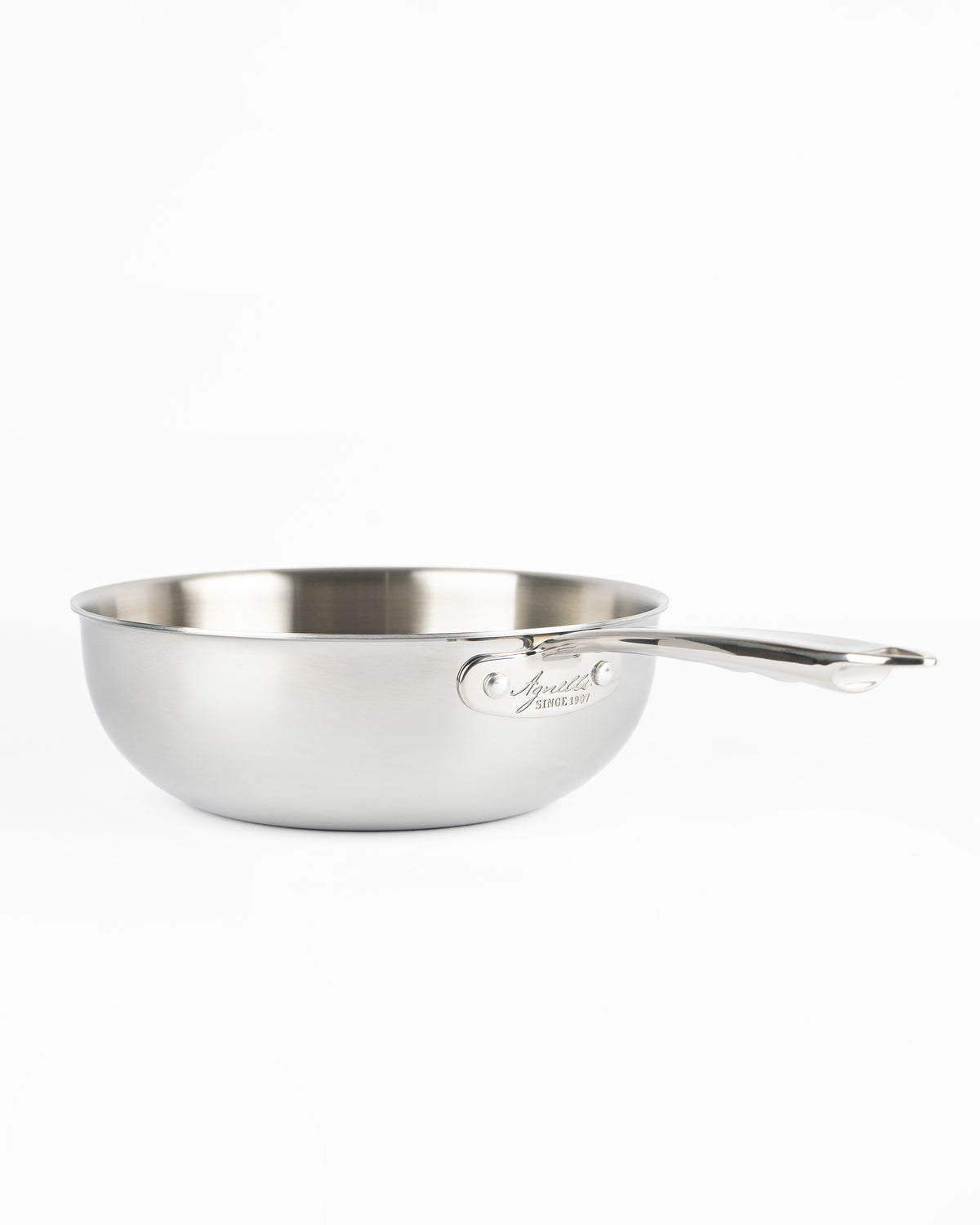 Glossy stainless steel pot, round with long handle, on white background. Engraved logo visible on side.