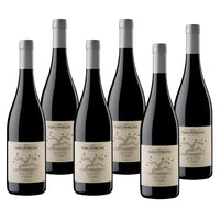 Six red wine bottles, beige label with black lettering, grey caps, tree design and "Fabio Perrone" logo.