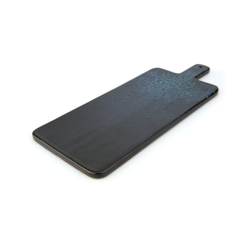 Rectangular black ceramic cutting board with smooth surface and blue top with shading, with handle and hole for hanging.