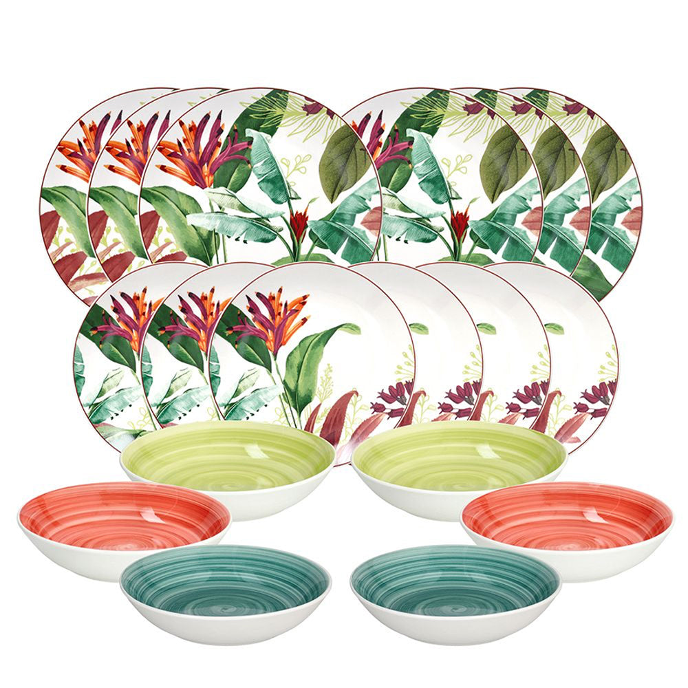 Set di piatti e ciotole in ceramica con decoro tropicale a foglie verdi e fiori arancioni, ciotole con interno colorato a spirale.