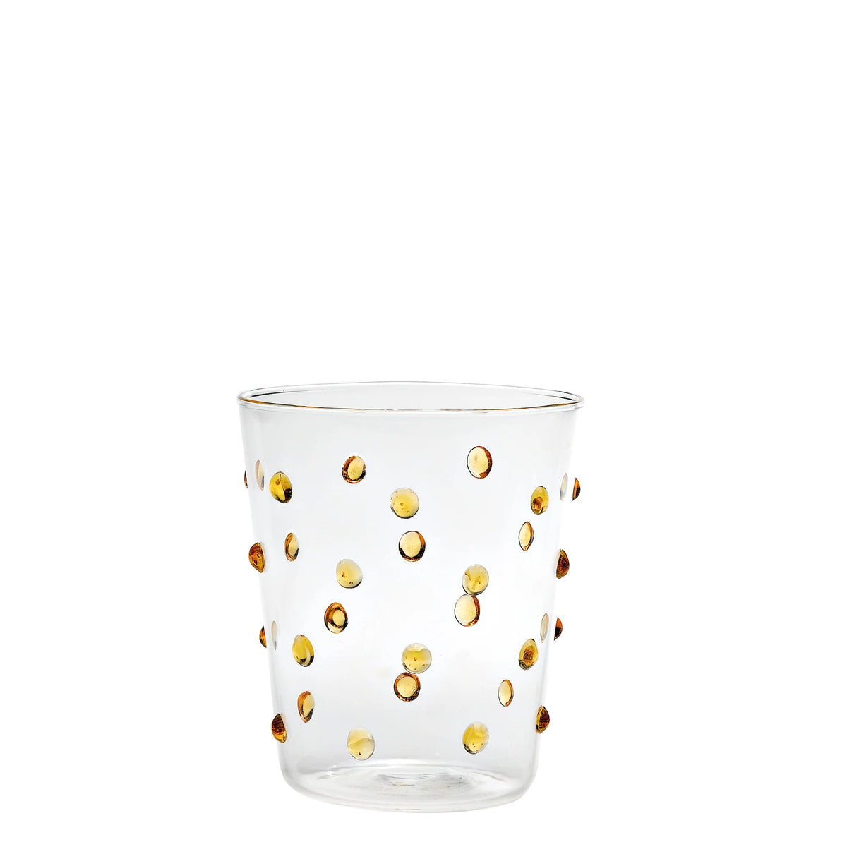 Bicchiere trasparente in vetro con decorazioni a rilievo a pois gialli e bordo dorato su sfondo bianco.