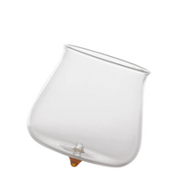 transparent glass container with wide rounded shape and small orange cap on the bottom, white background