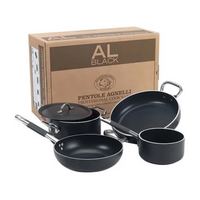 Set of 4 black pots and pans with steel handles, next to brown cardboard box with AL BLACK and Pentole Agnelli lettering.