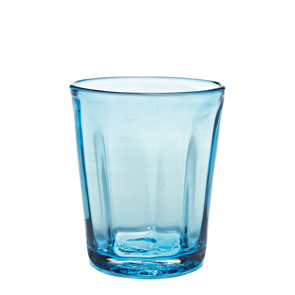 Transparent light blue glass tumbler with thick base and slightly flared rim on white background