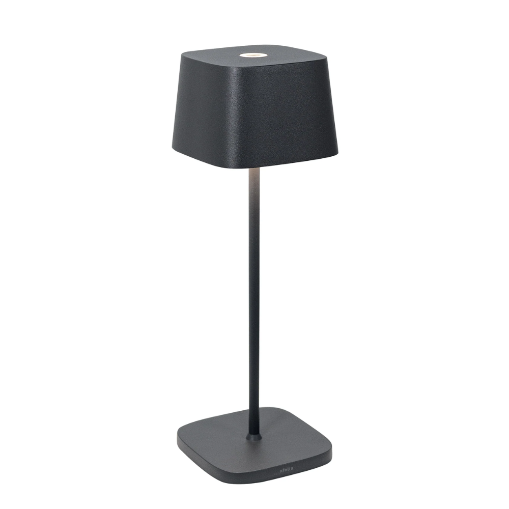 Black table lamp with square base and shade in matte material, modern minimal design on white background