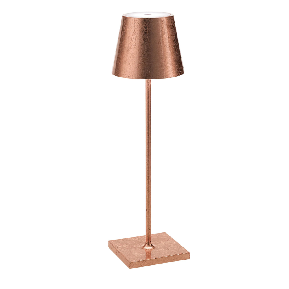 Copper colored metal table lamp with square base, slim cylindrical body and conical shade on white background