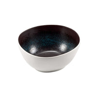 Bol en céramique avec extérieur blanc et intérieur noir à texture brillante et pointillé bleu, forme ronde à bord irrégulier