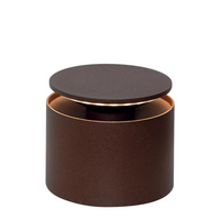 Matte dark brown cylindrical container with suspended round lid and copper-colored interior, on white background