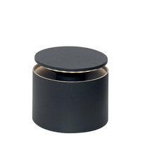 Matte black cylindrical container with raised circular lid, visible light beige interior.