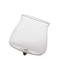 transparent glass tumbler with slightly pointed base and round mouth on white background