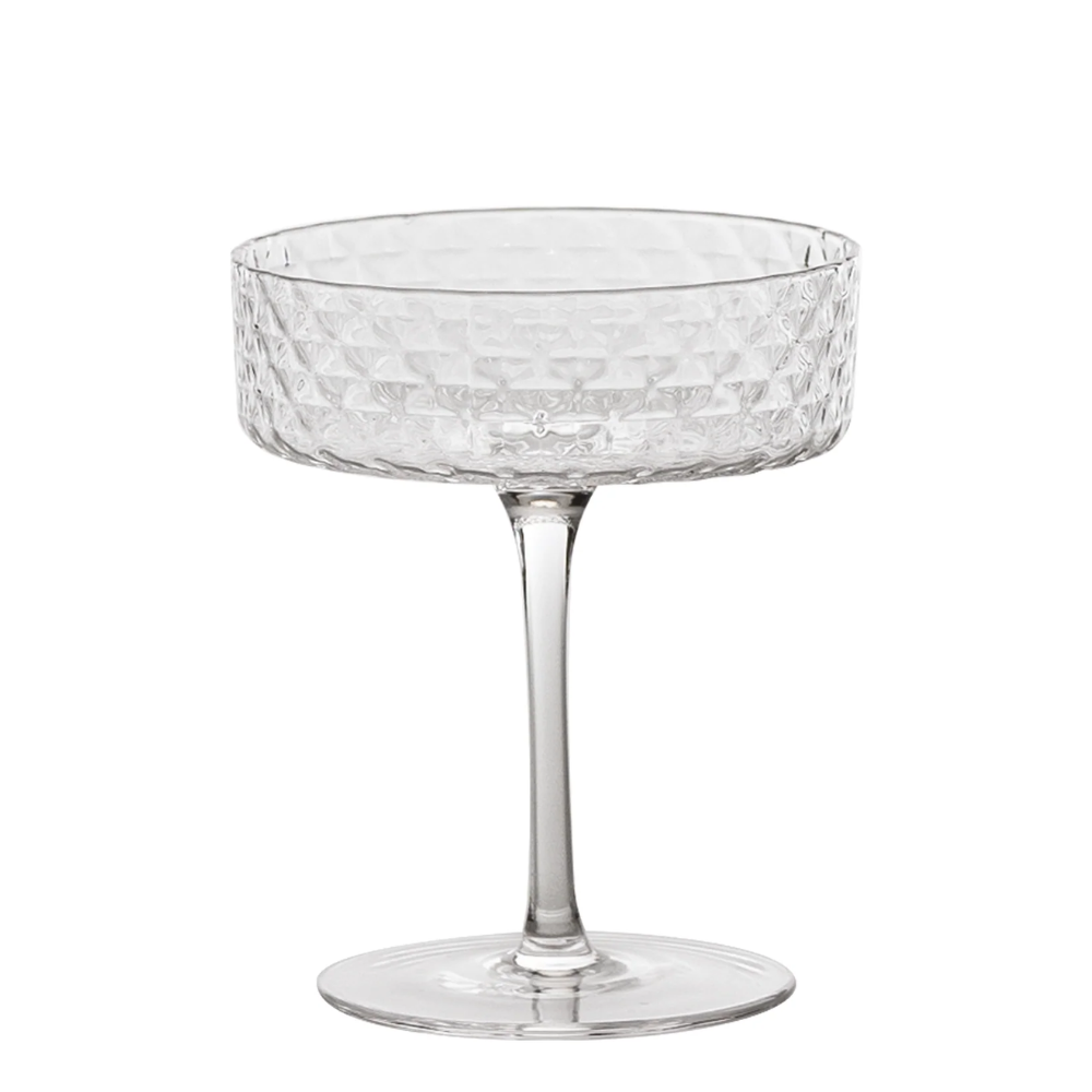 Verre transparent en verre avec large coupe courte décorée d'un motif hexagonal en relief, tige fine et base ronde plate