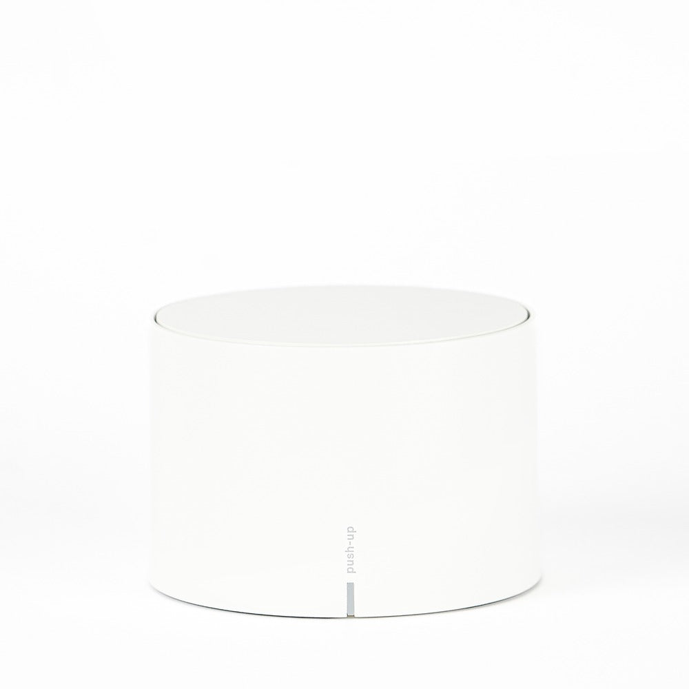 Glossy white cylindrical container with lid, smooth surface and "push-up" logo at the bottom. White background.