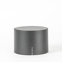 Grey cylindrical container with matte surface and "push-up" text on the front.