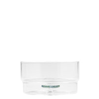 Transparent glass container, cylindrical shape, with slightly wider base and a colored disc inside.